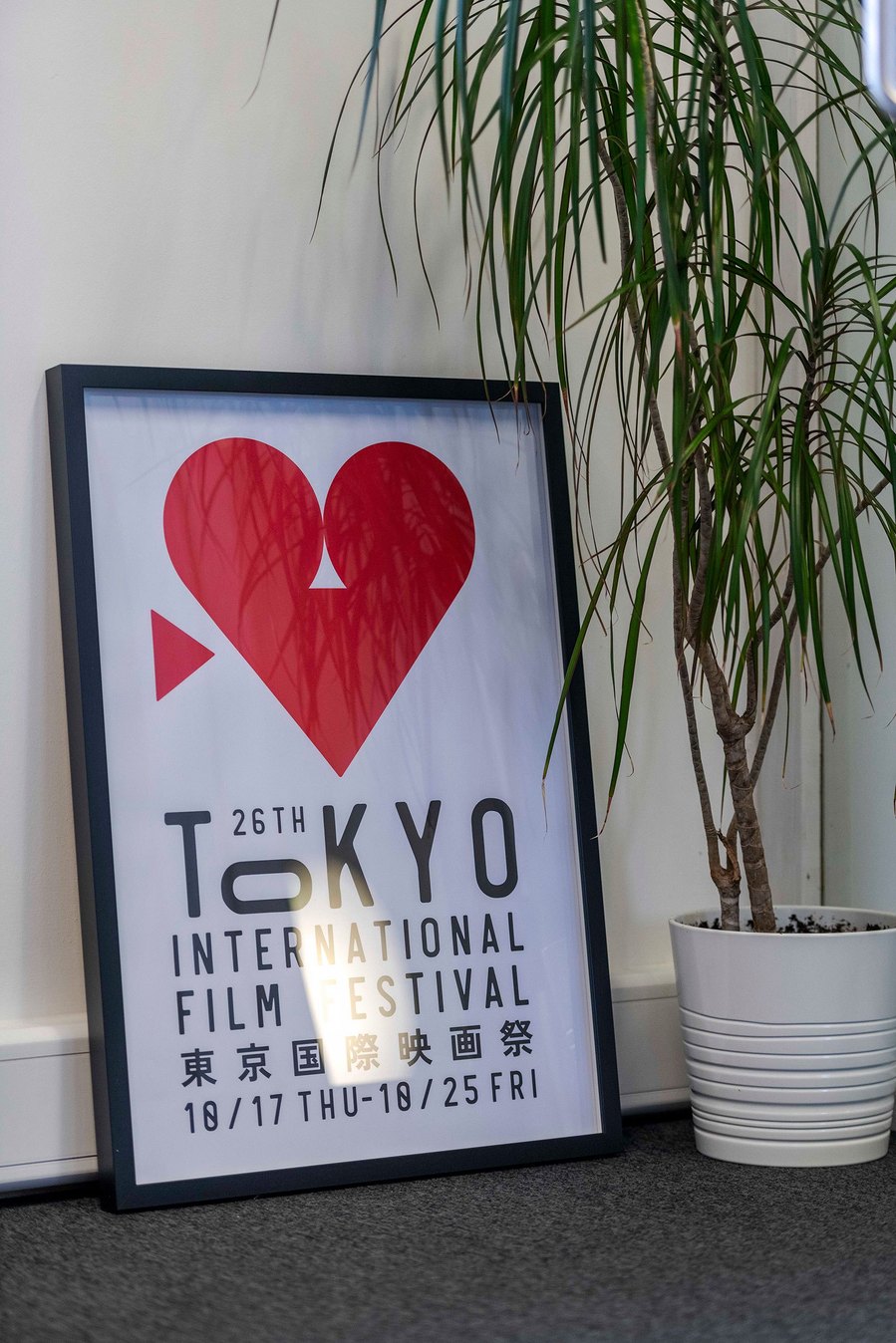 commercial lifestyle and office lifestyle, workplace, print in frame leans against wall