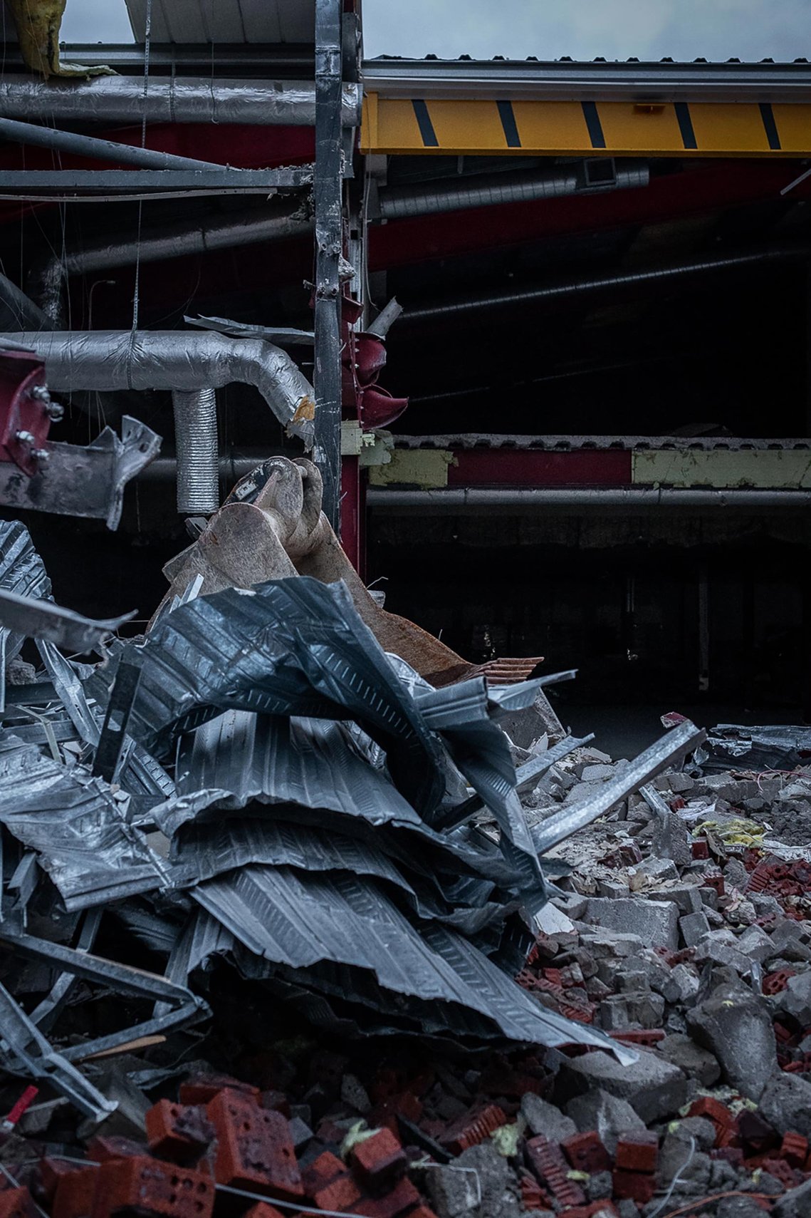 demolition site on shopping centre site, interior of building exposed by works.