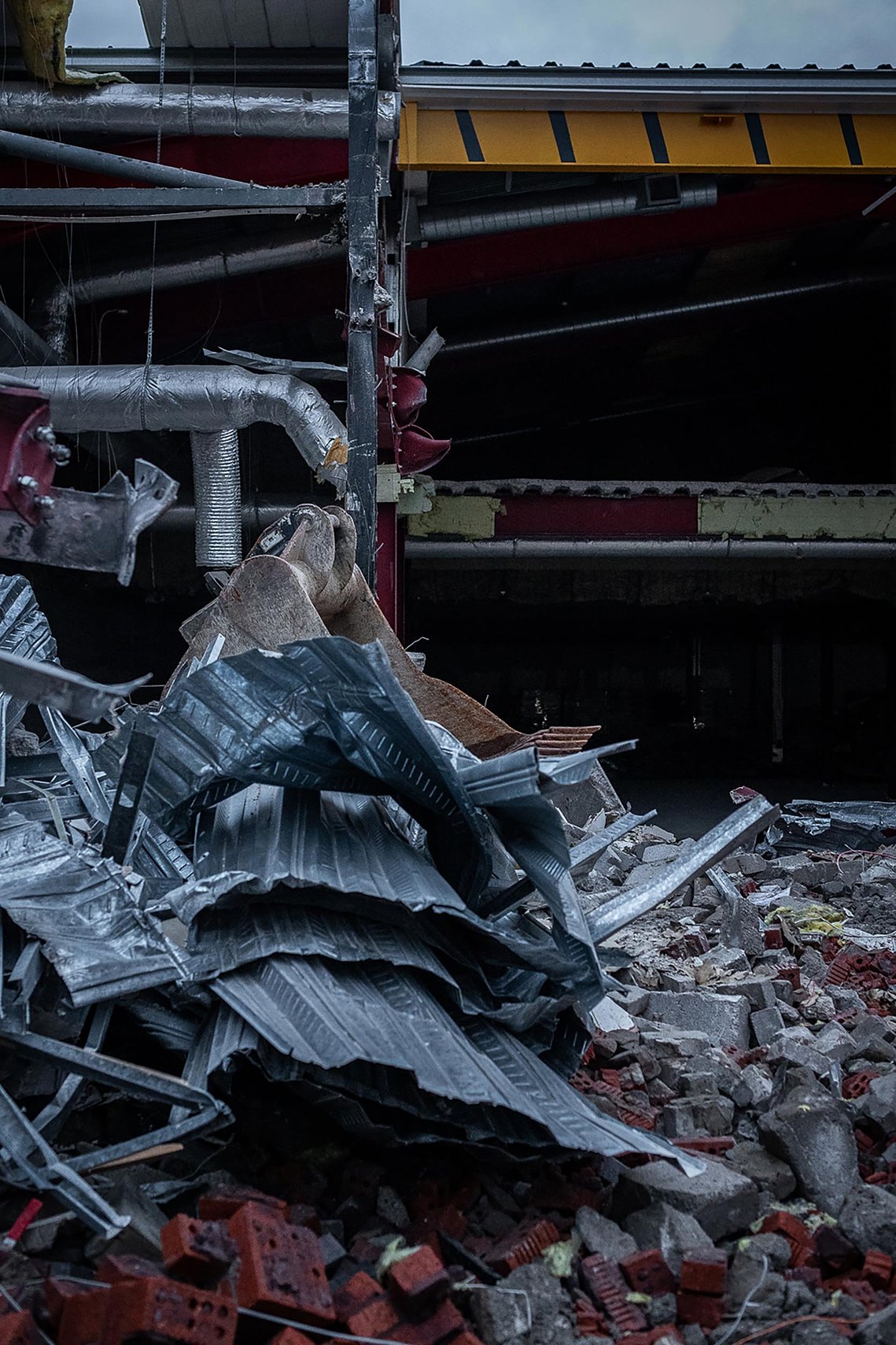 demolition site on shopping centre site, interior of building exposed by works.