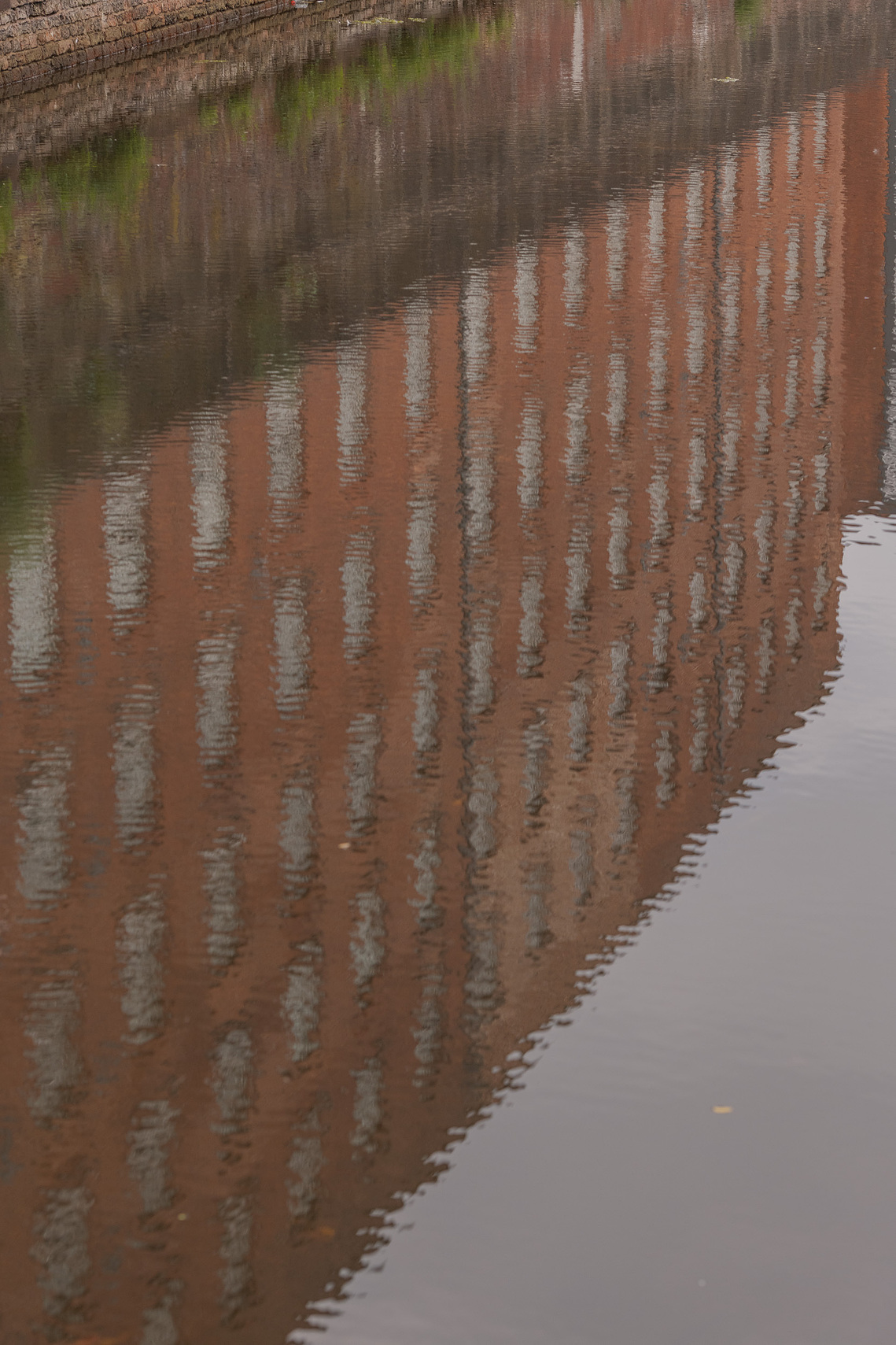 exploring how architecture interacts with natural light.	
architectural lifestyle photography Manchester
ancoats Murrays mill reflected in canal 