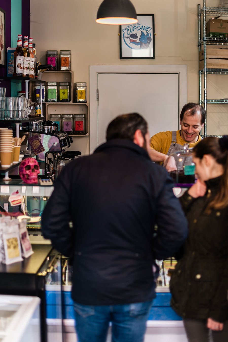 stockport lifestyle and placemaking photography, local shop owner serving customers