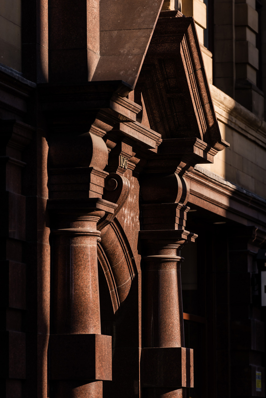 classic manchester architecture. city centre building. photographed with shadows across frontage of brickwork