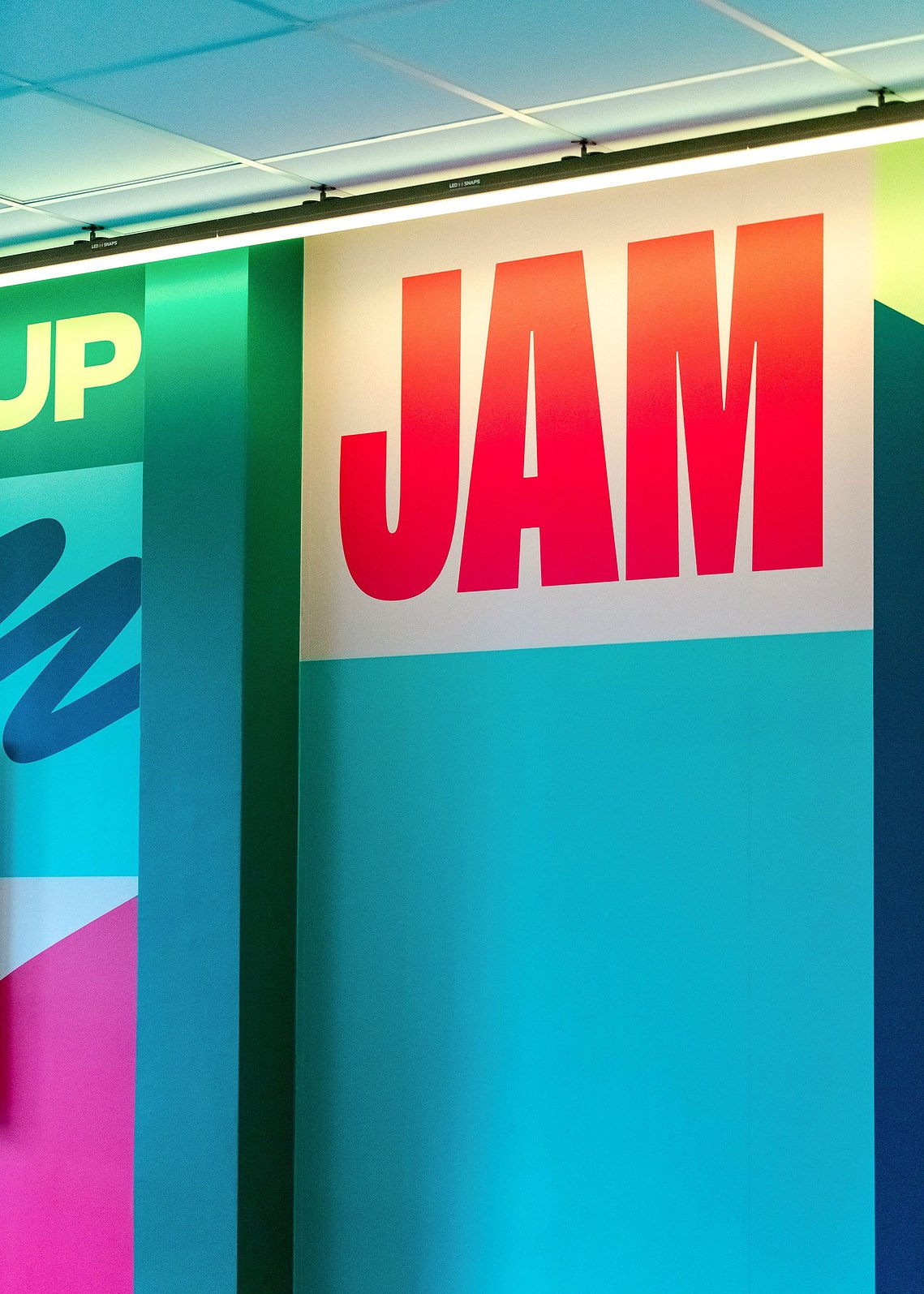 Architectural vinyl photography showcasing custom wall graphics and inspirational quotes. commercial interiors photography captures bold colours in vinyl graphics 