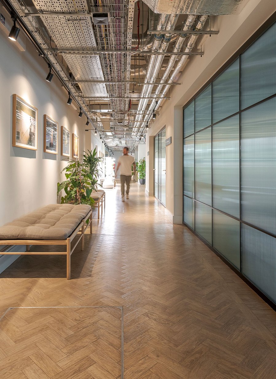 architecture photography, apartment building, London, corridor space with person walking
