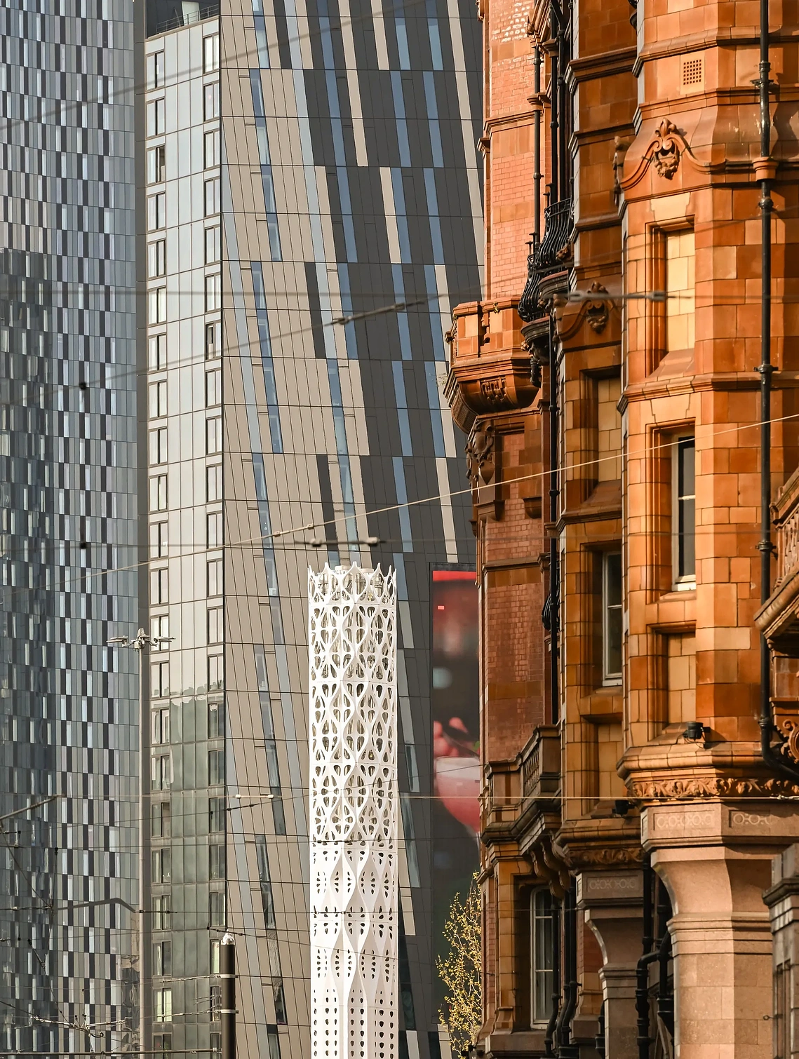 Architectural detail shot of historic and modern Manchester buildings framed in a cropped angle.
