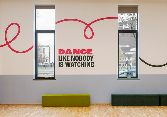 Jane Bowyer environmental graphics photography case study cover - scene shot a dance studio with windows and bright graphics