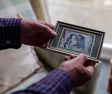 person holding old photo