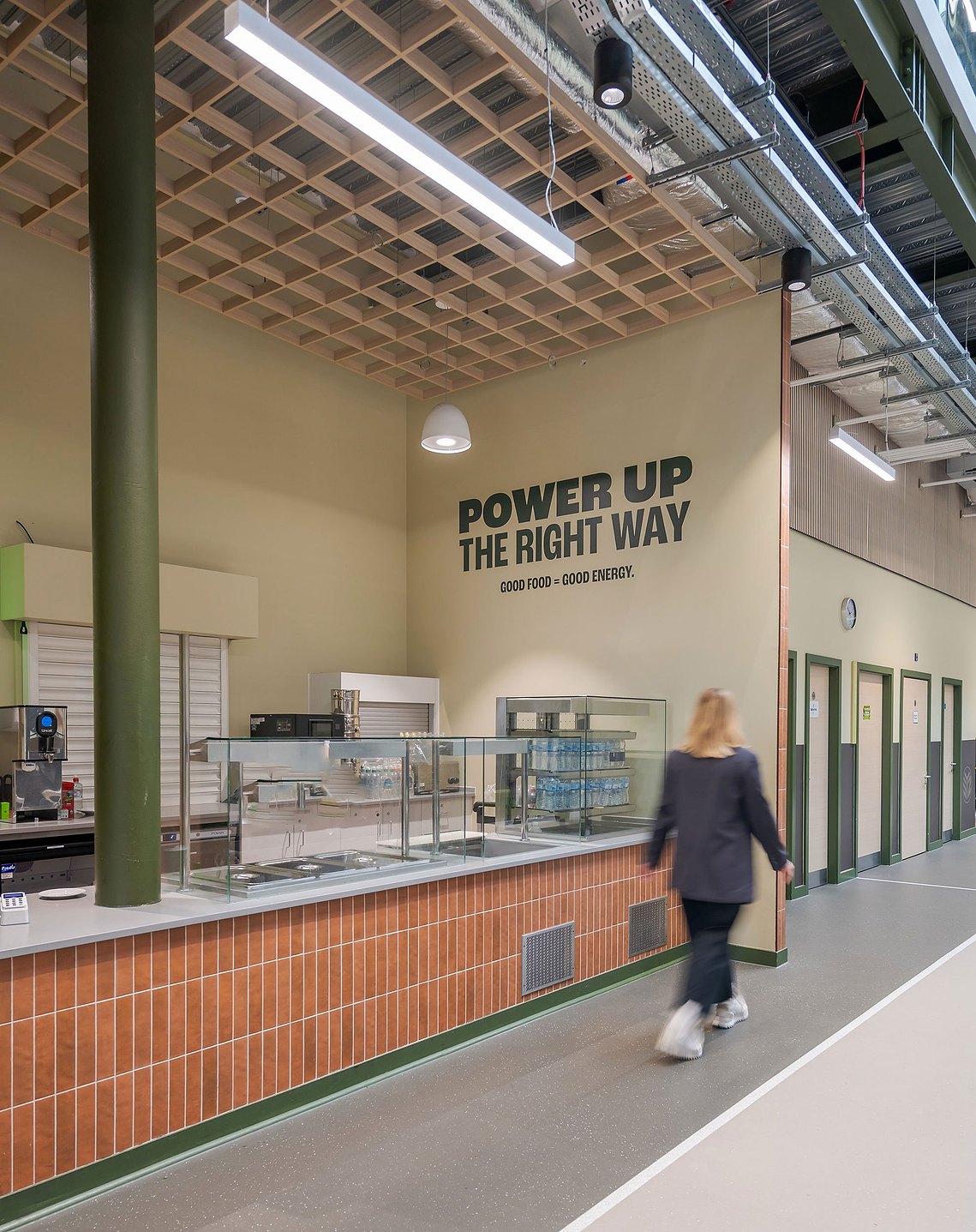Experiential design photography capturing the spatial layout and colourful wall branding inside a Manchester community youth centre
