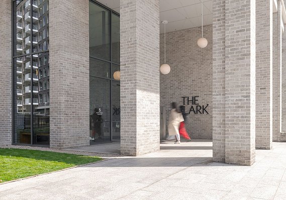 Case Study Photography Cover For Property Marketing Photography For 'The Lark' In Nine Elms, London, showing people arriving at the entrance of a modern building 