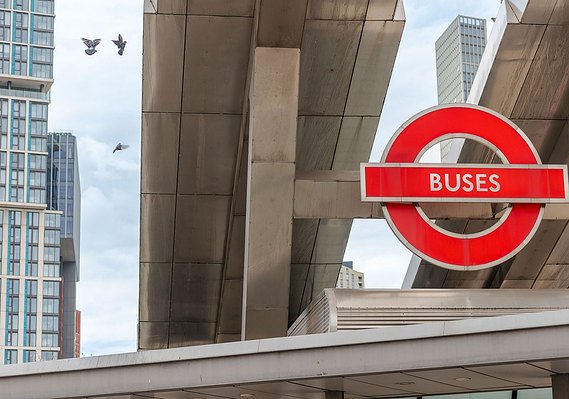 Placemaking photography showing a photo of a London bus sign, with infrastructure and buildings in background
