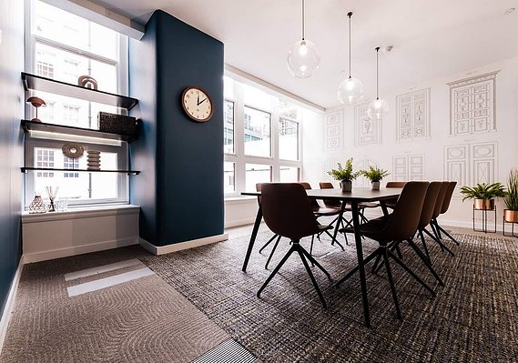 Office interior with long table and multiple chairs. A meeting room. Modern design. Natural light 