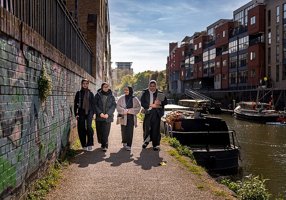 Case Study Photography Cover For Marketing And Student Lifestyle Photography For University Of Cumbria shows students walking along a canal with boats