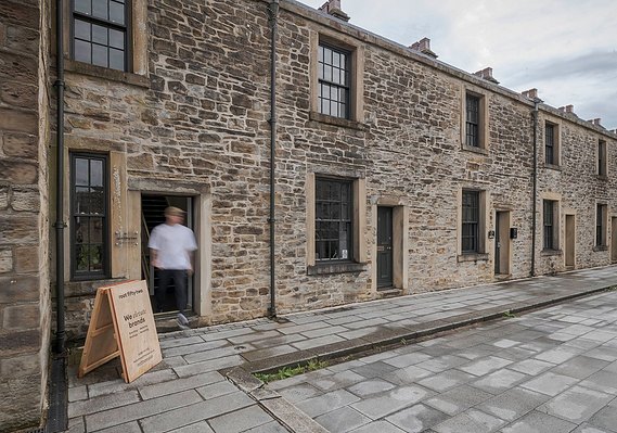 Case Study Photography Cover For Brand And Commercial Lifestyle Photography For Burnley Marketing Agency showing outside of studio with man at doorway