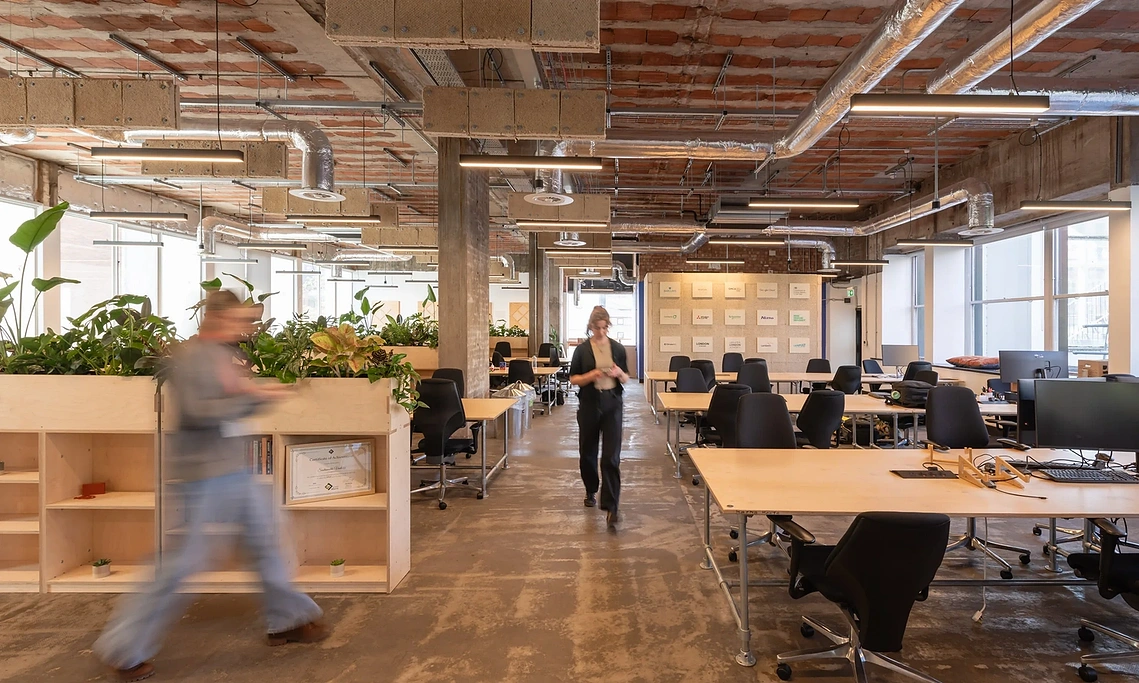 Commercial lifestyle photography capturing workers using U-Build modular office furniture and collaboration spaces. 