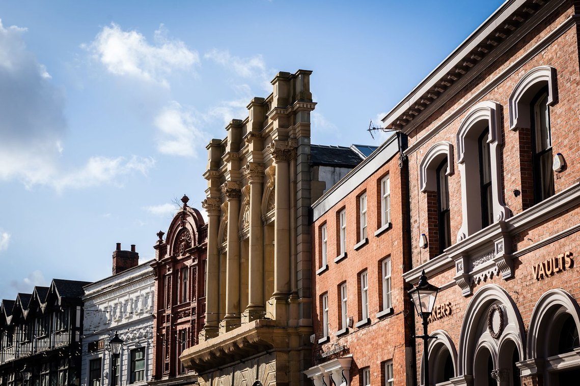 Stockport placemaking and architecture photography, cropped image shows terrace of local bars and shops and style of local architecture