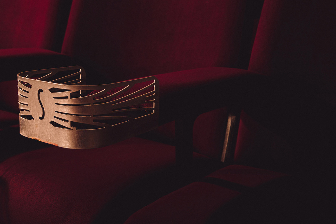 red velvet cinema seat, vintage, cupholder