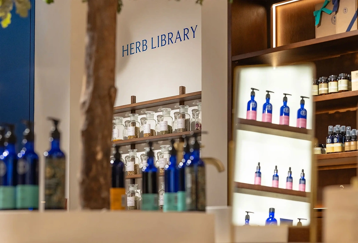 Interior retail photography showing the product displays and shelving inside Neal's Yard Manchester.