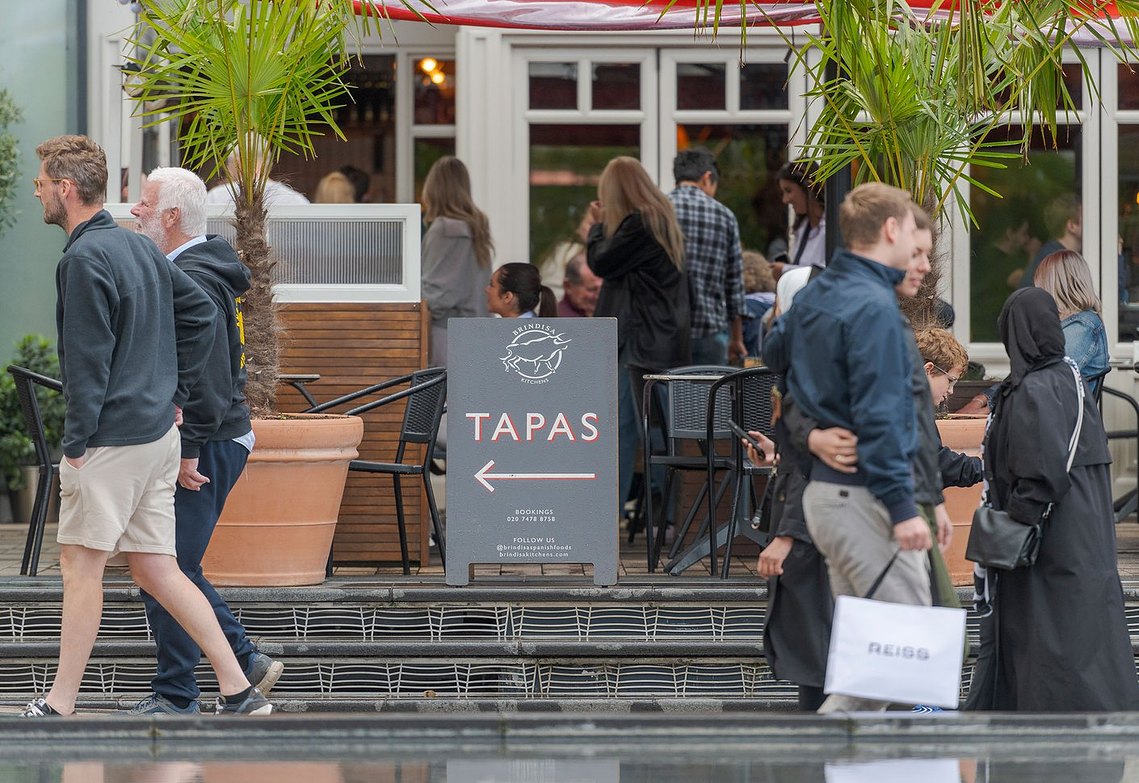 placemaking and lifestyle photography, london, battersea, tapas restaurant, people walking past and sat outside