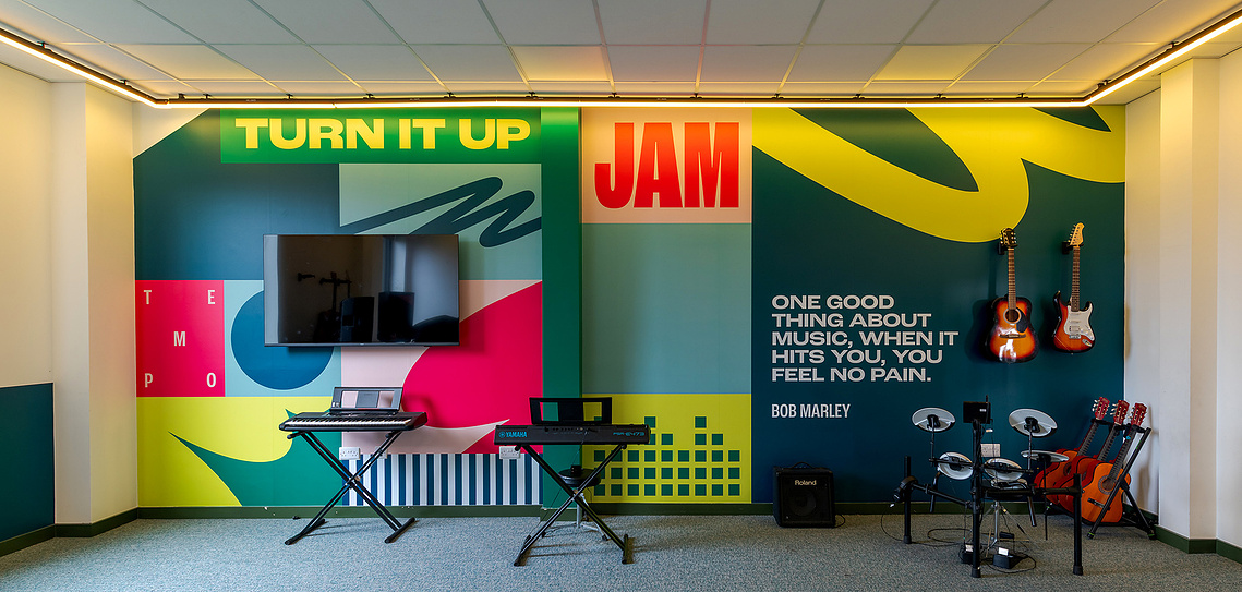 Detail shot by commercial interior photographer Manchester, showcasing a close up of high quality graphic installations   in a music room context
