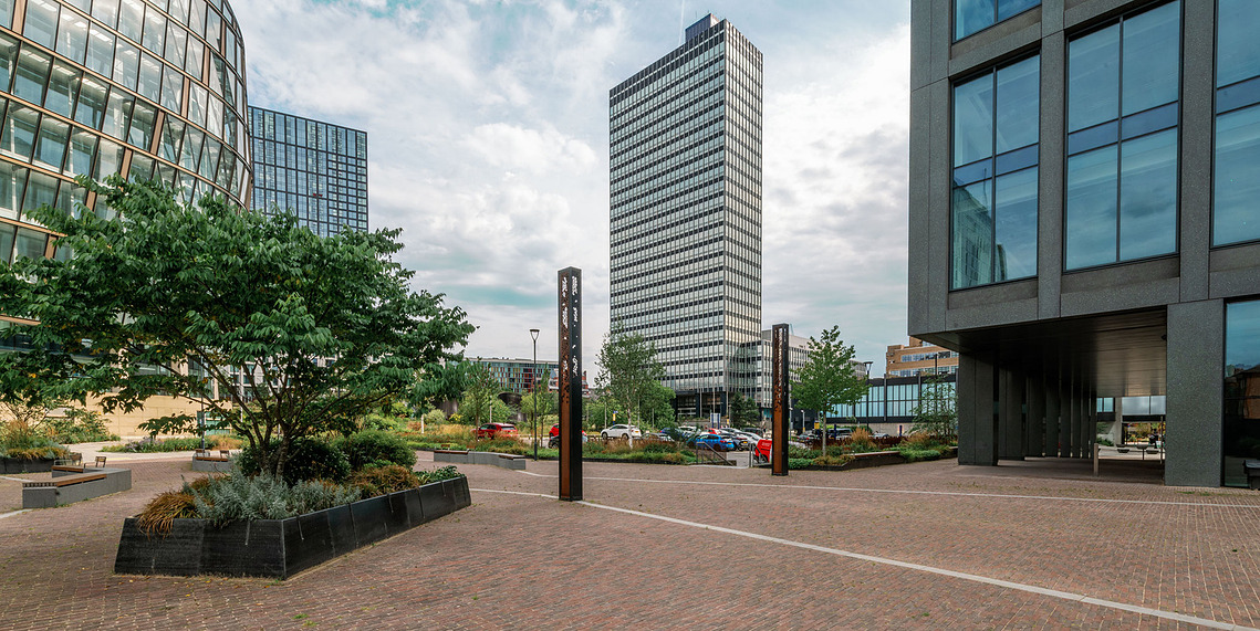 Placemaking architecture photography showing the CIS Building in context with NOMA buildings in Manchester