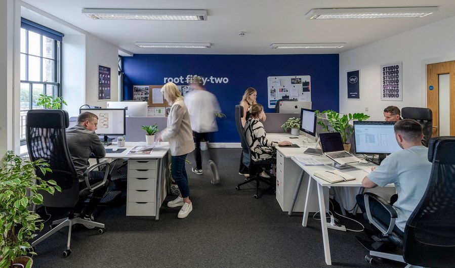 commercial lifestyle and office lifestyle, workplace, team members interact in wide open plan office