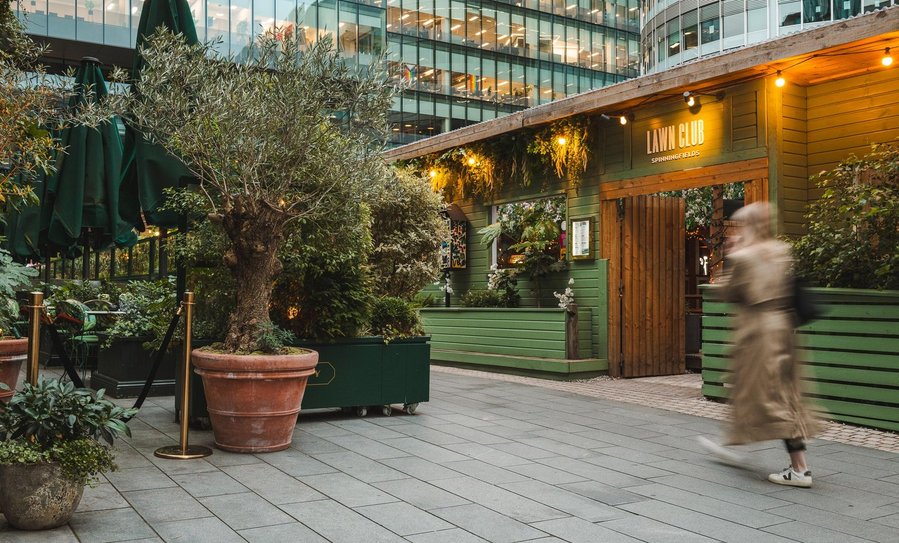 URBAN LIFESTYLE AND LOCAL AREA PHOTOGRAPHY OF SPINNINGFIELDS, MANCHESTER, blurred person walking past restaurant door