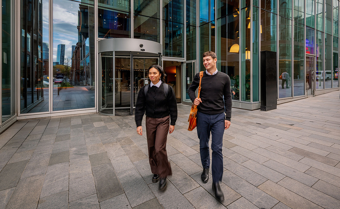 Lifestyle photography of professionals leaving building at 3 Hardman Street in Manchester
