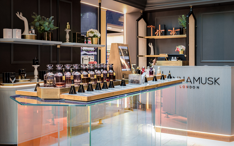 high end fragrance kiosk in situ in manchester Trafford Centre, shows interior with displays of products