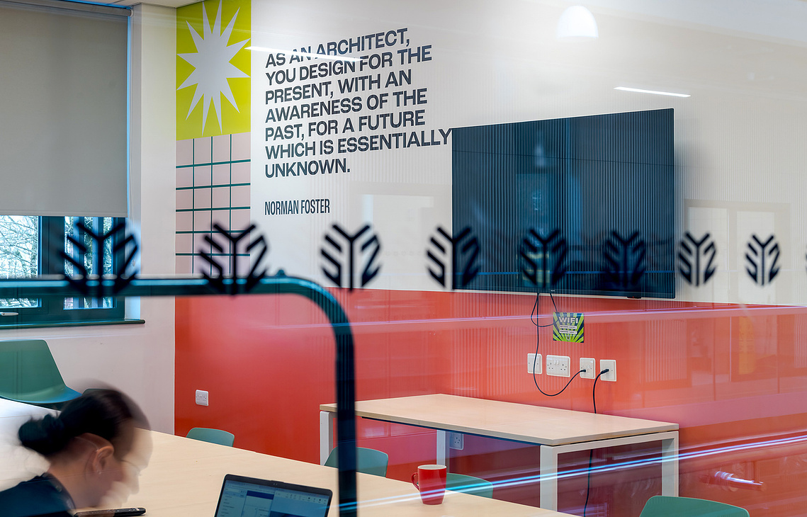 experiential design photography capturing the spatial layout and colourful wall branding inside a Manchester community youth centre. vinyl graphics designed by Jane bowyer