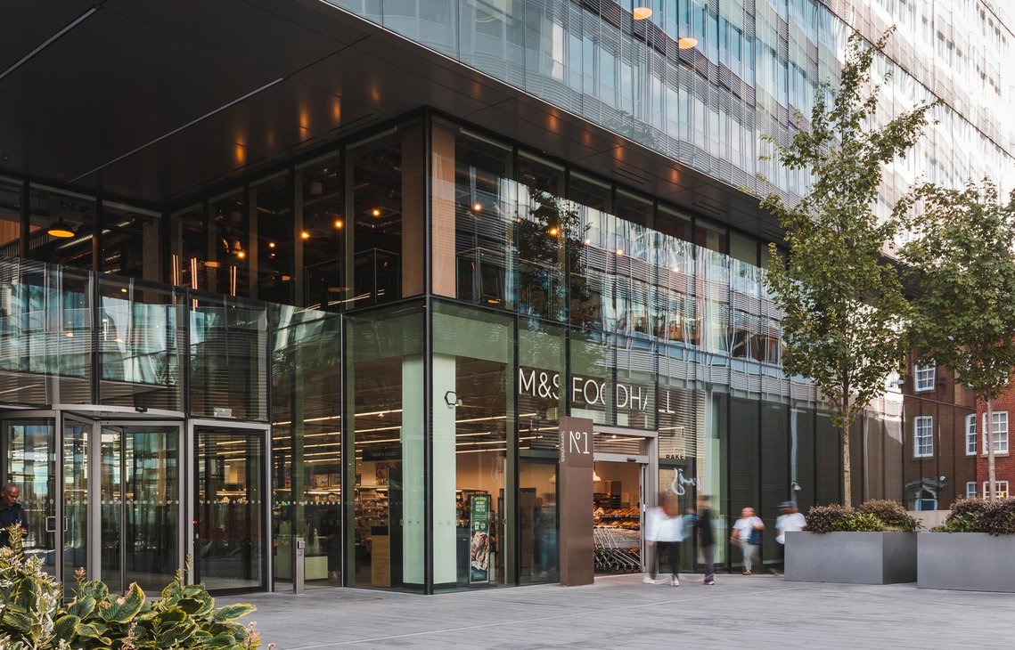 URBAN LIFESTYLE AND LOCAL AREA PHOTOGRAPHY OF SPINNINGFIELDS, MANCHESTER, architecture photography showing high rise glass building with food store and blurred shoppers