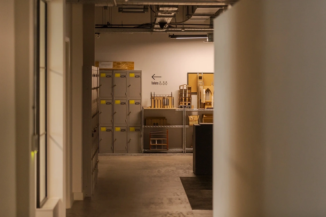 Architectural models and lockers with signage in learning space