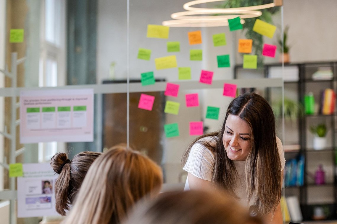 commercial lifestyle photography showing staff in a workplace, team members collaborating and discussing work