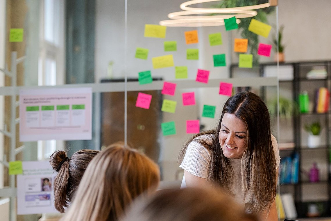 commercial lifestyle photography showing staff in a workplace, team members collaborating and discussing work
