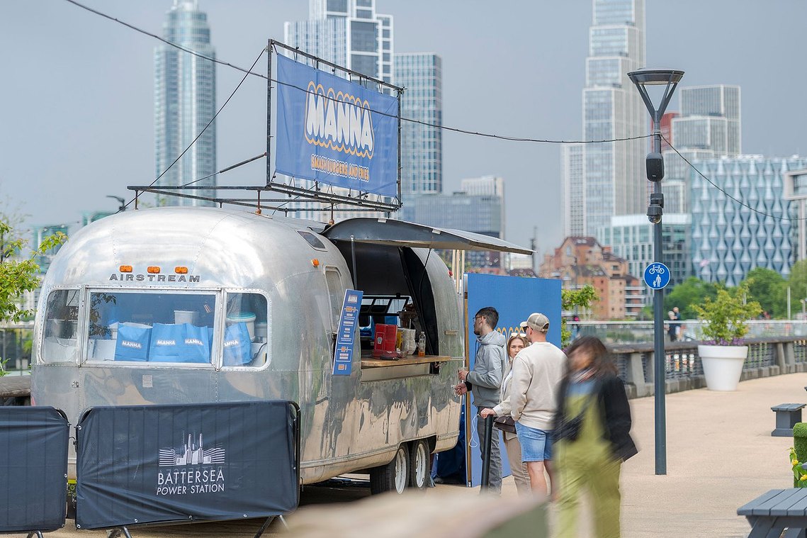 london placemaking and lifestyle photography, airstream van selling food with london cityscape backdrop