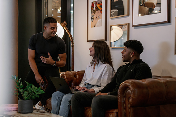 Commercial lifestyle photography, small team breakout meeting on sofa