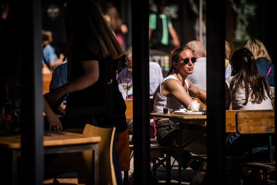 Placemaking and lifestyle photography,
Leisure and hospitality destination,
Customers sat outside bar
