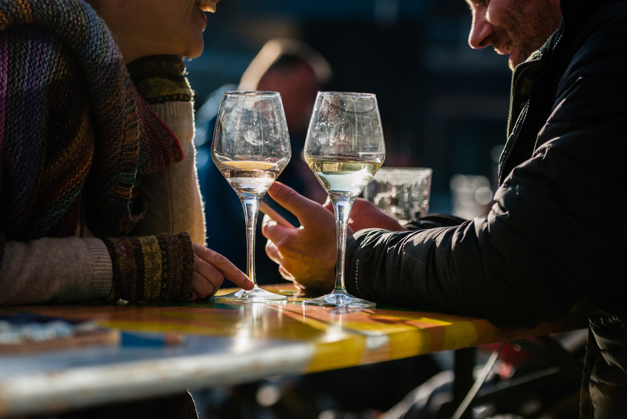 Placemaking and lifestyle photography,
Leisure and hospitality destination,
Customers sat outside bar