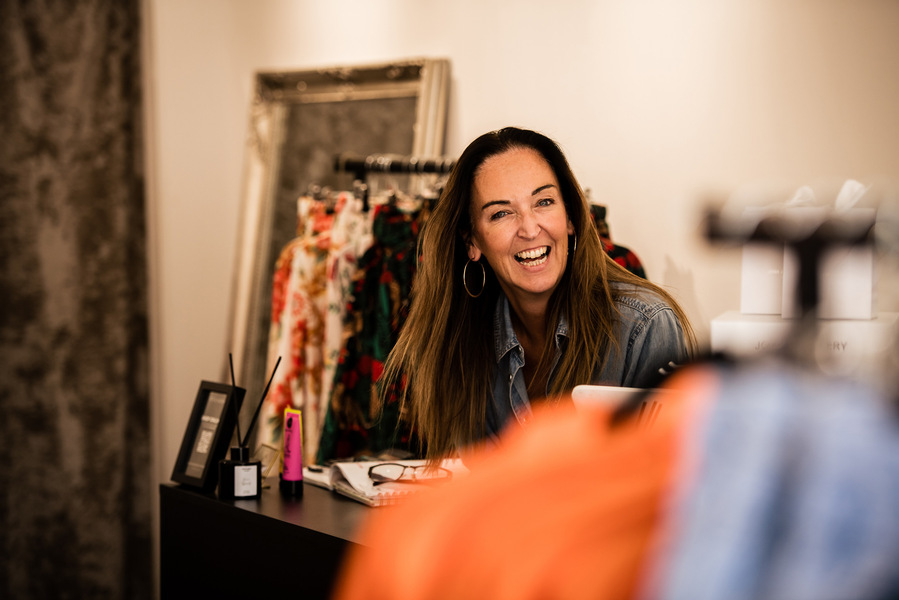 Placemaking and lifestyle photography,
Leisure and hospitality destination,
shop owner smiling over the counter