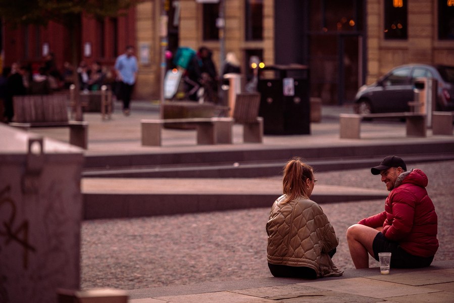 placemaking photography. manchester. norther quarter. architecture. customers sit in public square