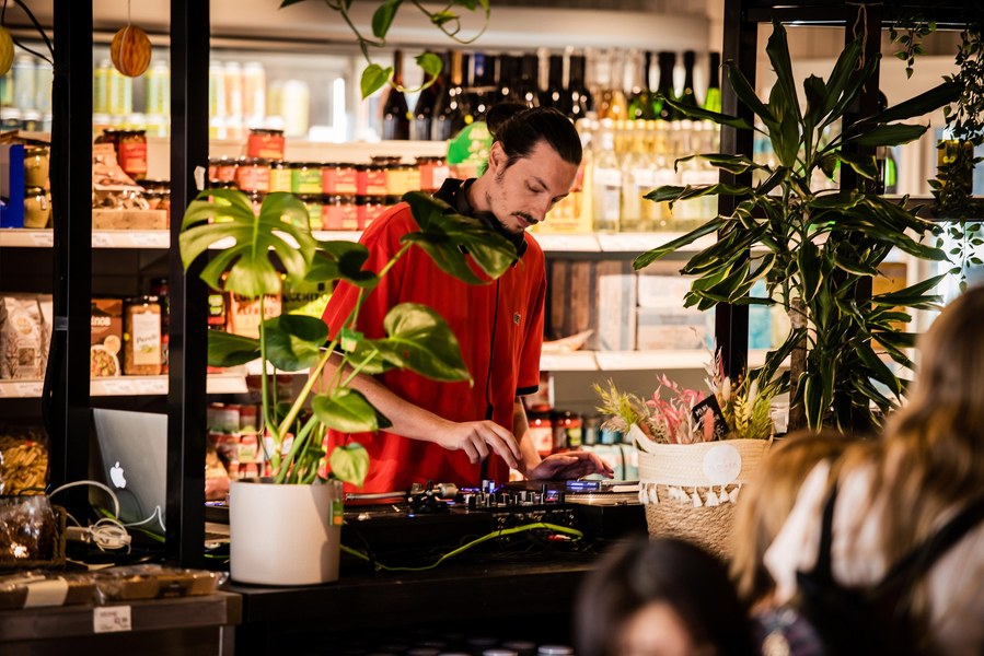 Placemaking and lifestyle photography,
Leisure and hospitality destination,
Shop and bar with dj playing records