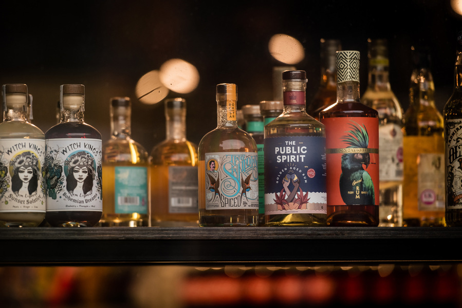 Placemaking and lifestyle photography,
Leisure and hospitality destination,
bottles of spirits on bar shelf