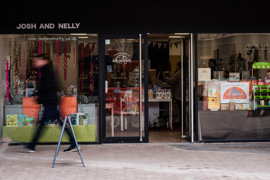 Placemaking and lifestyle photography,
Leisure and hospitality destination,
shopper walks past door