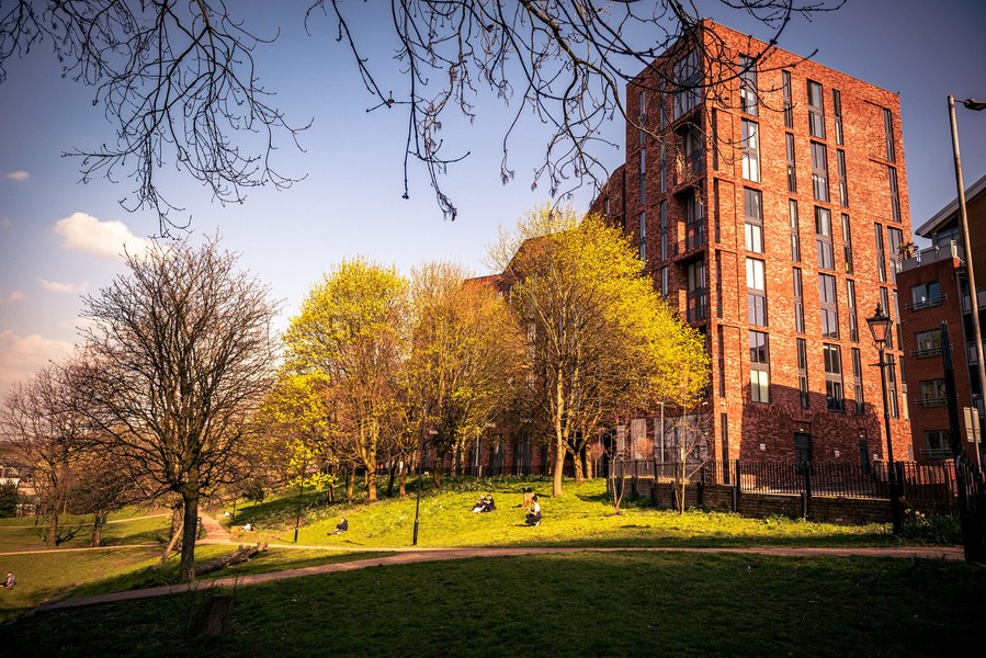 placemaking photography. manchester. norther quarter. architecture. green space in front of an apartment building