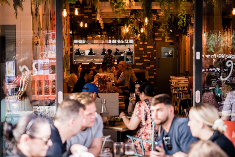 Placemaking and lifestyle photography,
Leisure and hospitality destination,
Customers sat outside bar
Customers sat inside cafe lit by sunlight