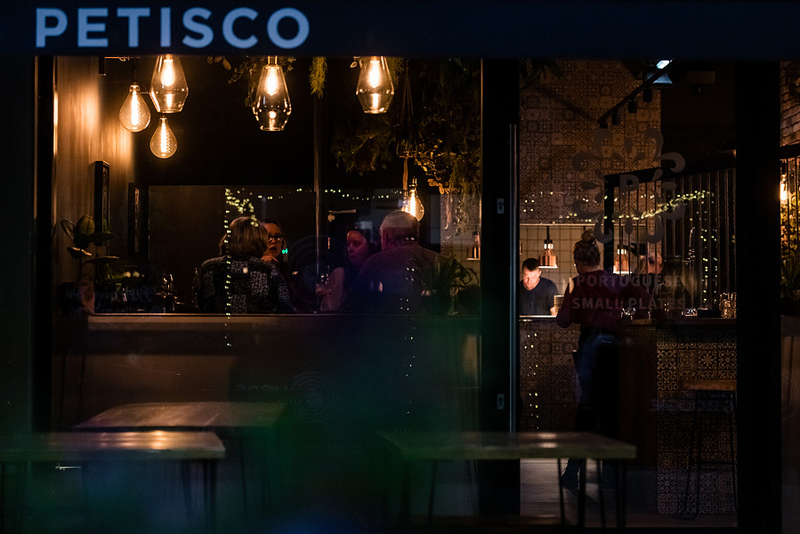 Placemaking and lifestyle photography,
Leisure and hospitality destination,
looking through windows of a restaurant