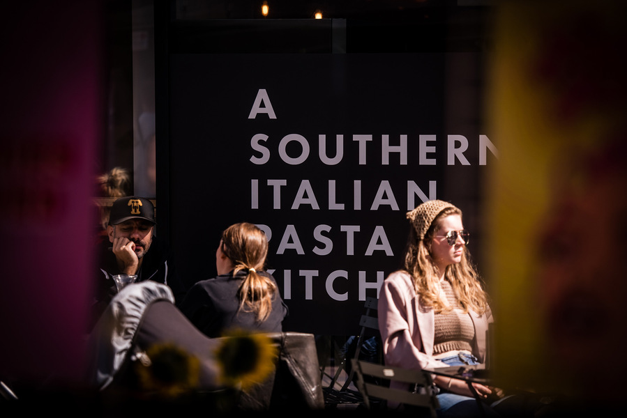 Placemaking and lifestyle photography,
Leisure and hospitality destination,
Customers sat outside in sunshine