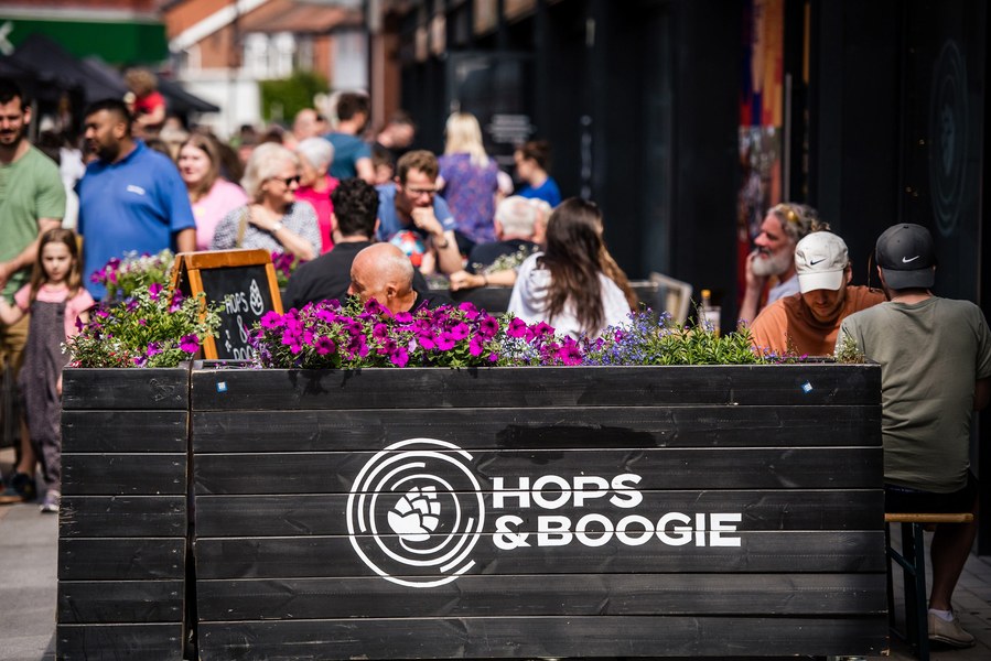 Placemaking and lifestyle photography,
Leisure and hospitality destination,
Customers sat outside bar