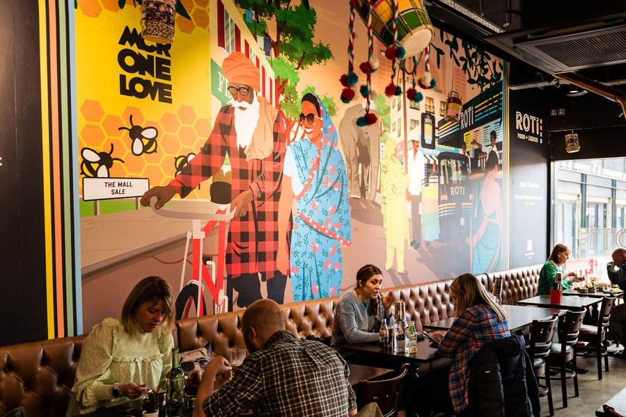 Placemaking and lifestyle photography,
Leisure and hospitality destination,
Customers sat inside cafe, artwork on wall