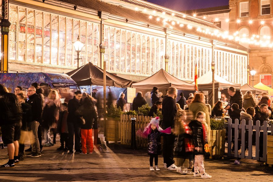 stockport lifestyle and placemaking photography, local street architecture, food market, evening, long exposure, customers