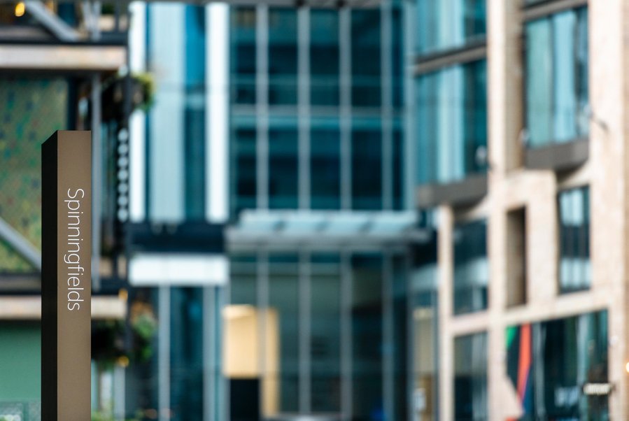 URBAN LIFESTYLE AND LOCAL AREA PHOTOGRAPHY OF SPINNINGFIELDS, MANCHESTER, cropped shot shows architecture detail and signage 